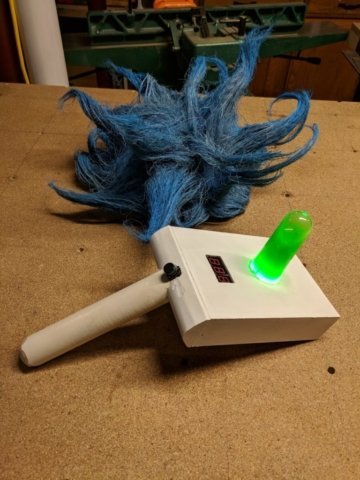Props from the show Rick and Morty, portal gun and wig
